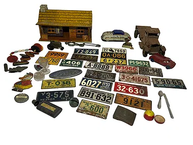 Vintage collectibles lot - license plates, toy trucks, log cabin, cast iron toys