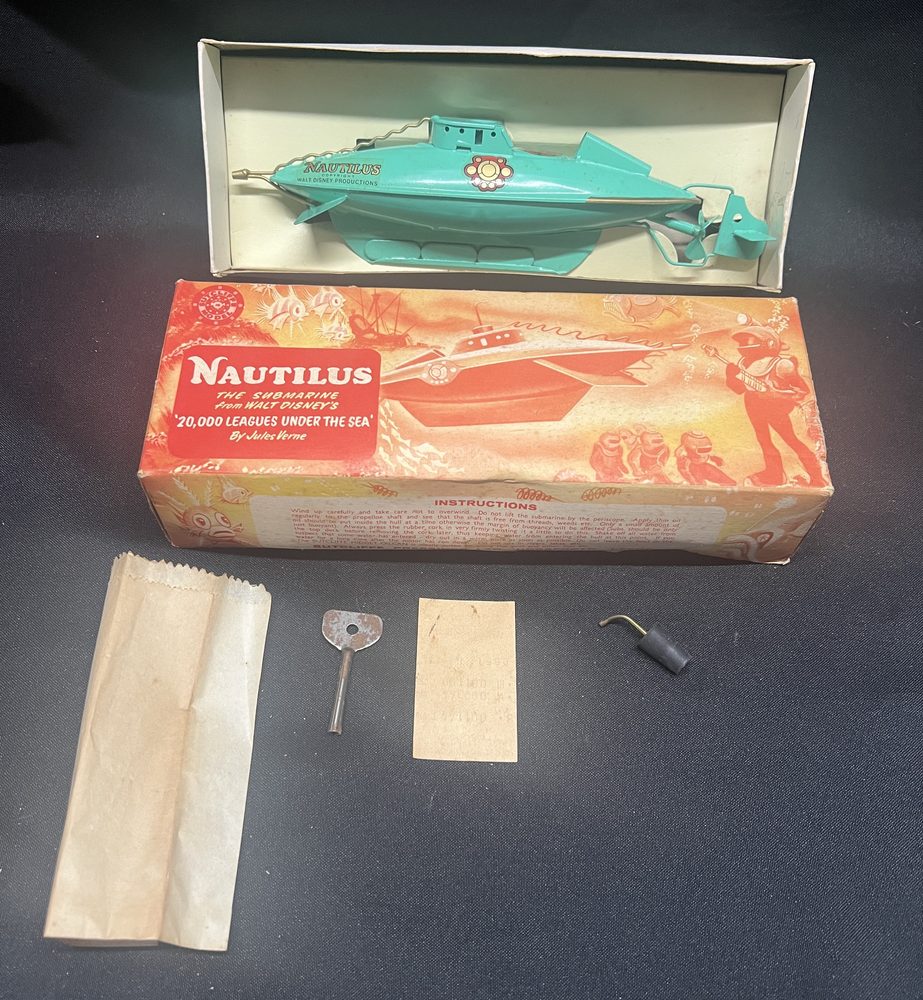 Sutcliffe Nautilus submarine tin toy from Walt Disney's 20,000 Leagues Under the Sea, with original box, key and accessories