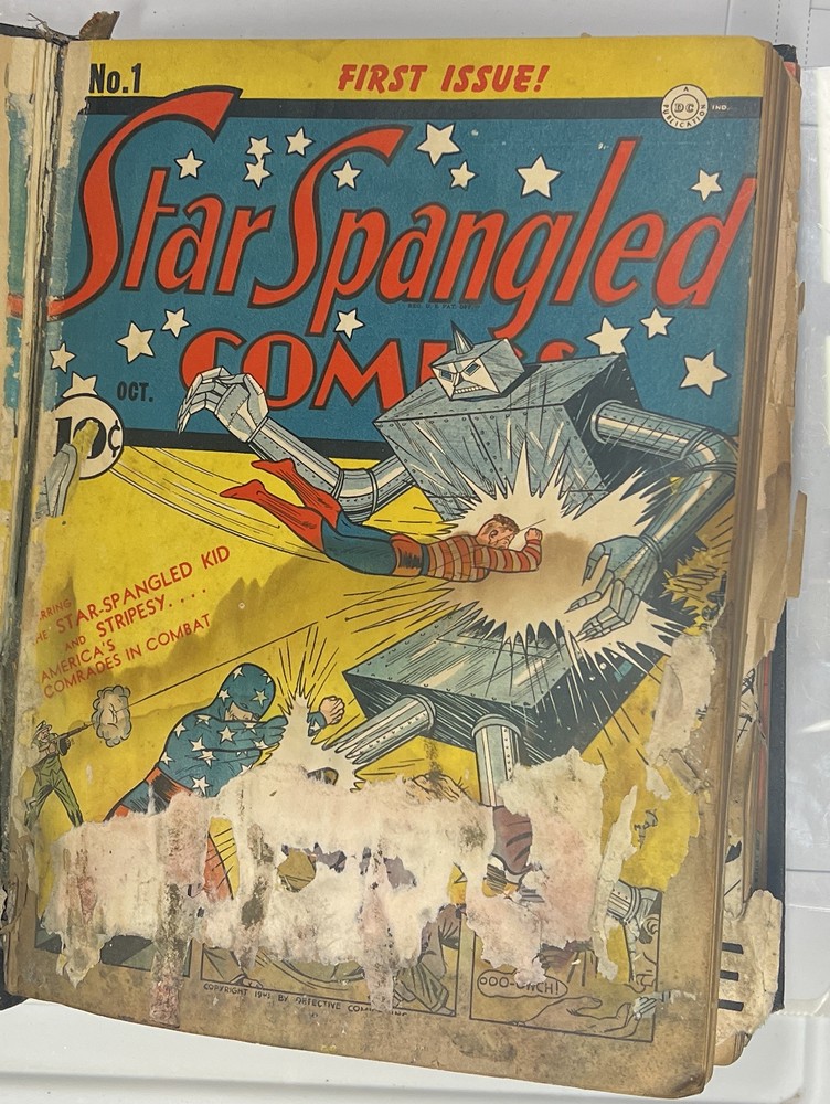 Bound volume of Star Spangled Comics issues 1 through 15, DC 1941-1942, open to the No. 1 first issue cover featuring the Star-Spangled Kid and Stripesy